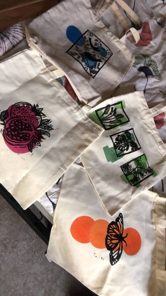 Hand-printed prototype totes with bird, pomegranate, leaf and butterfly block prints