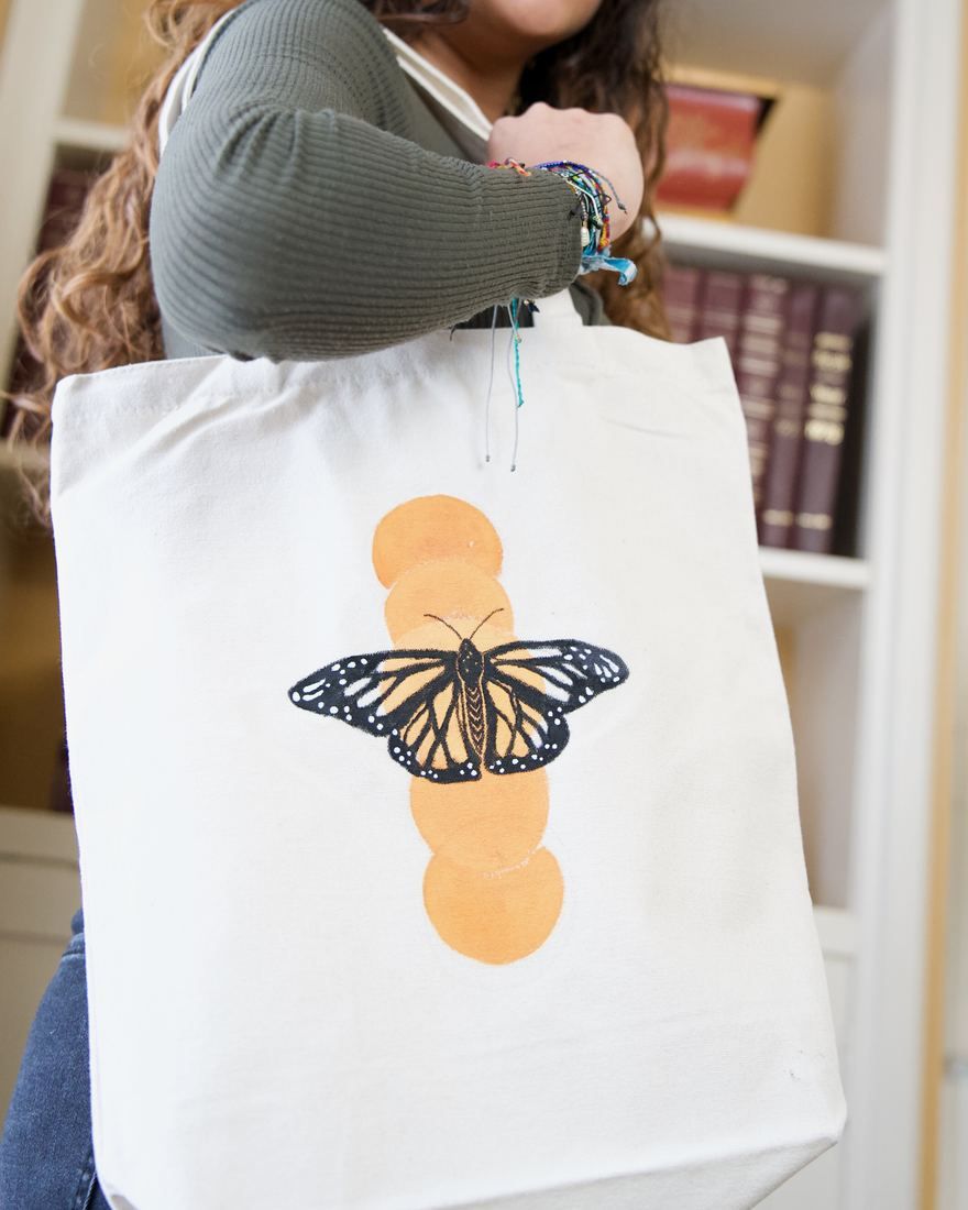 Flutter Butterfly tote: monarch butterfly over warm orange circles
